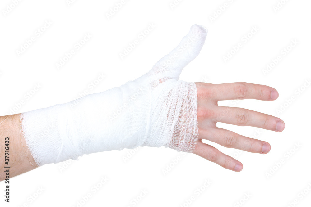 Bandaged hand isolated on white