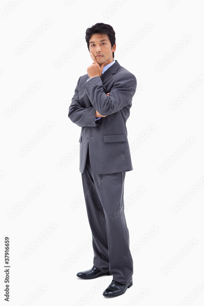 Portrait of a doubtful businessman with the arms crossed Portrait of a doubtful businessman with the arms crossed