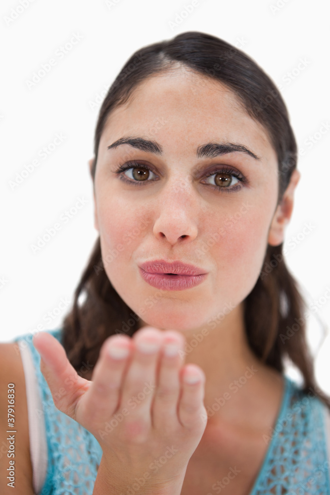 Portrait of a woman blowing a kiss Portrait of a woman blowing a kiss