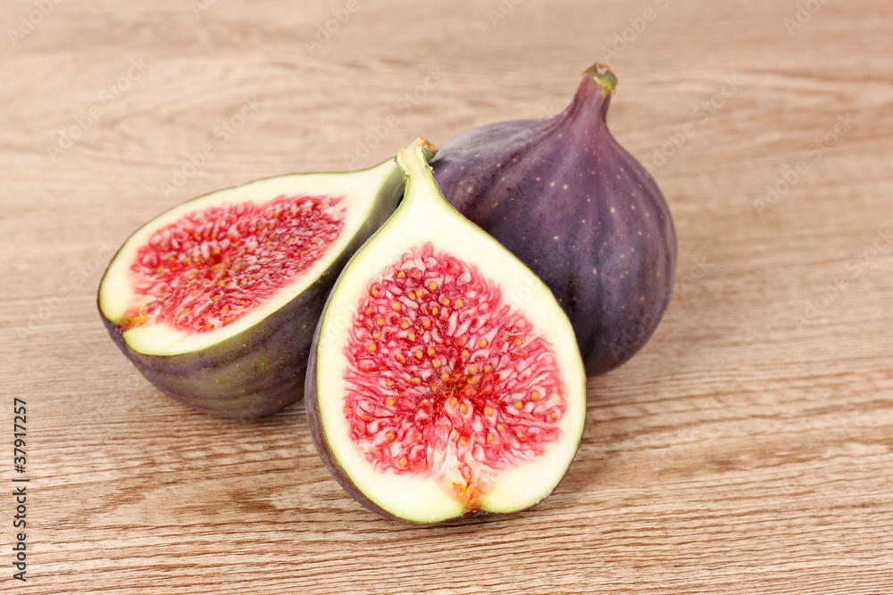 Ripe figs on wooden background Ripe figs on wooden background