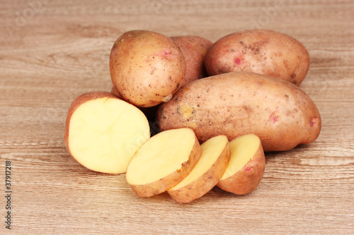 Potatoes on wooden background