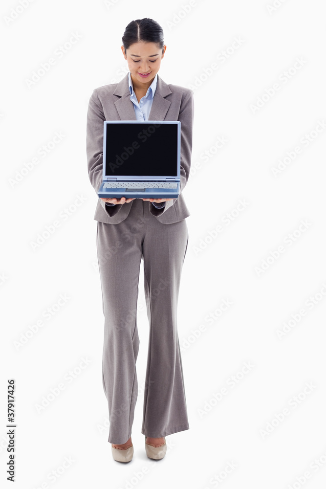 Portrait of a smiling businesswoman showing a notebook Portrait of a smiling businesswoman showing a notebook