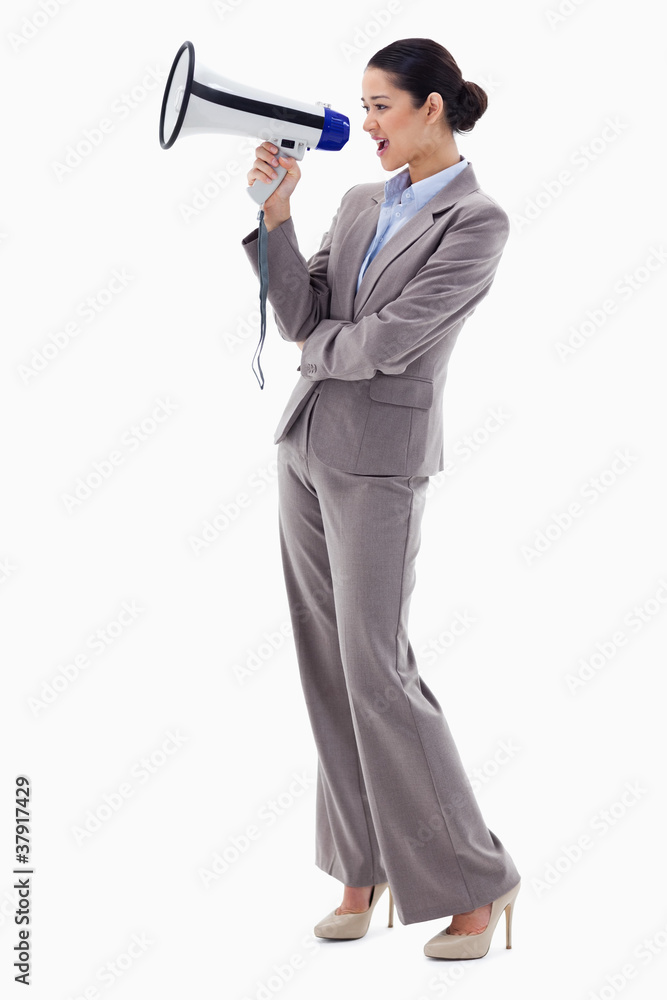 Fototapeta premium Portrait of a businesswoman shouting through a megaphone