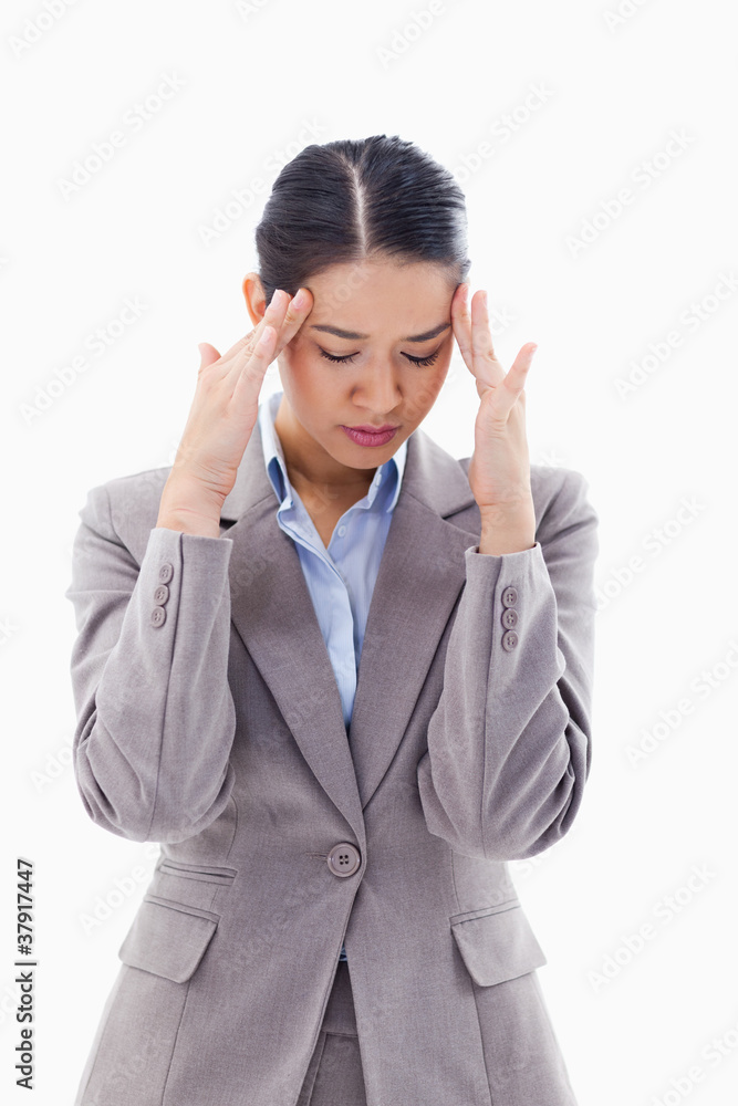 Portrait of a beautiful businesswoman having a headache Portrait of a beautiful businesswoman having a headache