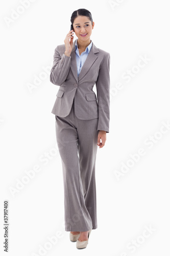 Portrait of a brunette businesswoman making a phone call