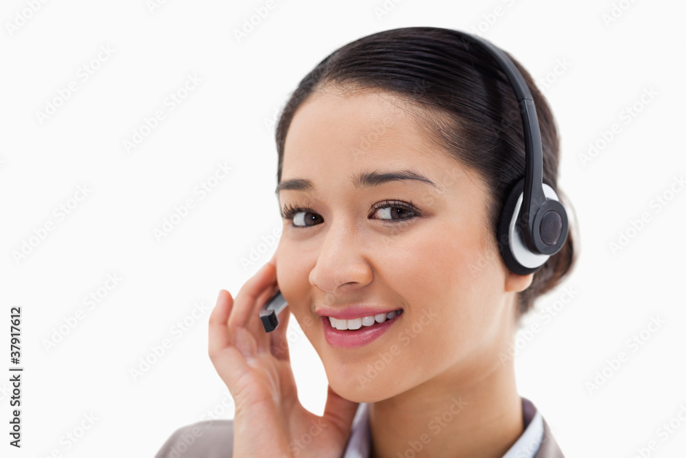 Close up of a smiling operator posing with a headset Close up of a smiling operator posing with a headset