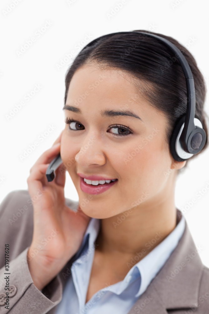 Portrait of a beautiful office worker posing with a headset Portrait of a beautiful office worker posing with a headset