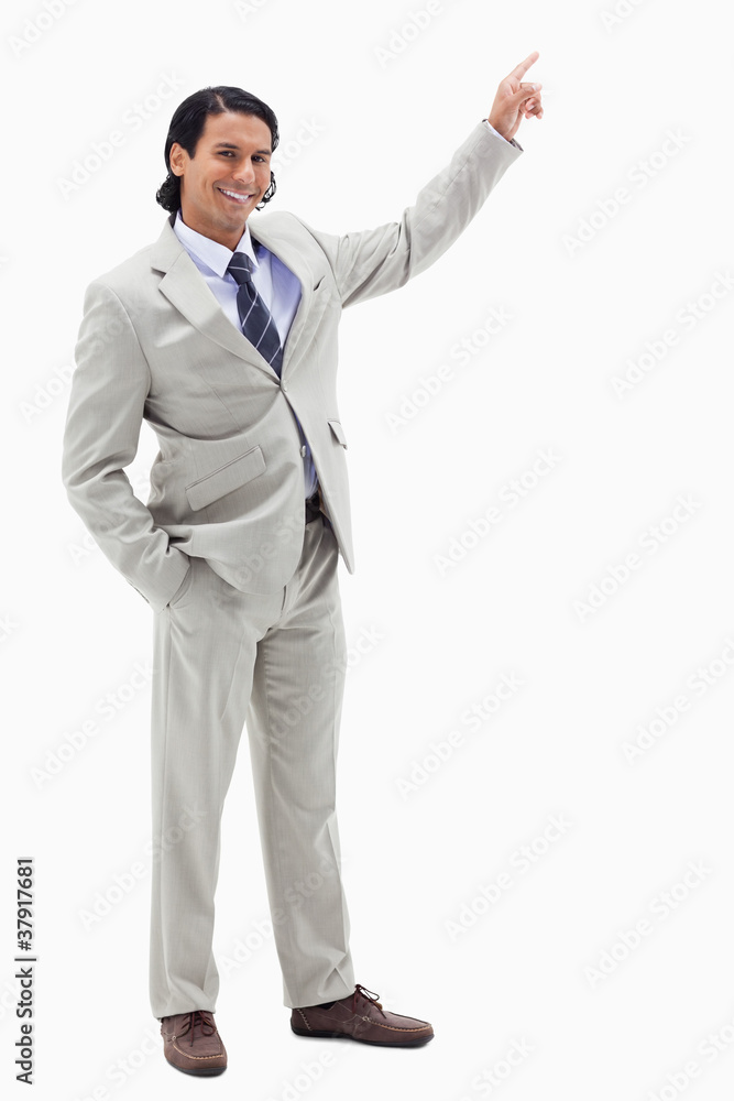 Portrait of a smiling businessman pointing at a copy space Portrait of a smiling businessman pointing at a copy space