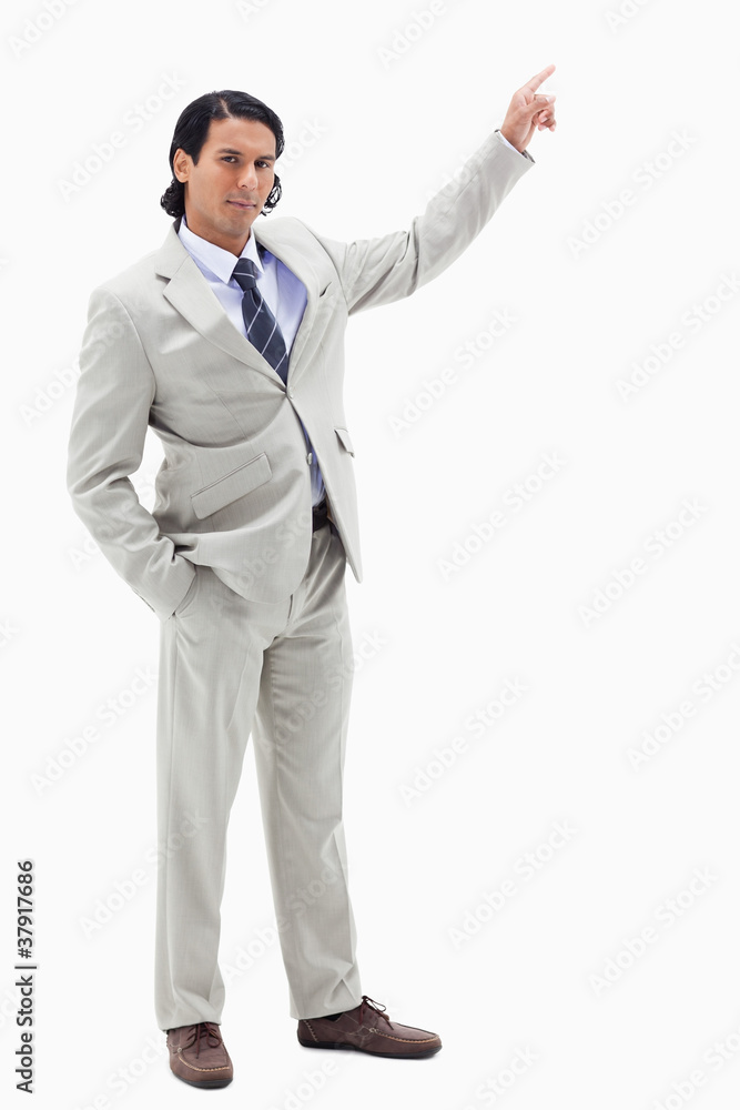 Portrait of a serious businessman pointing at a copy space Portrait of a serious businessman pointing at a copy space