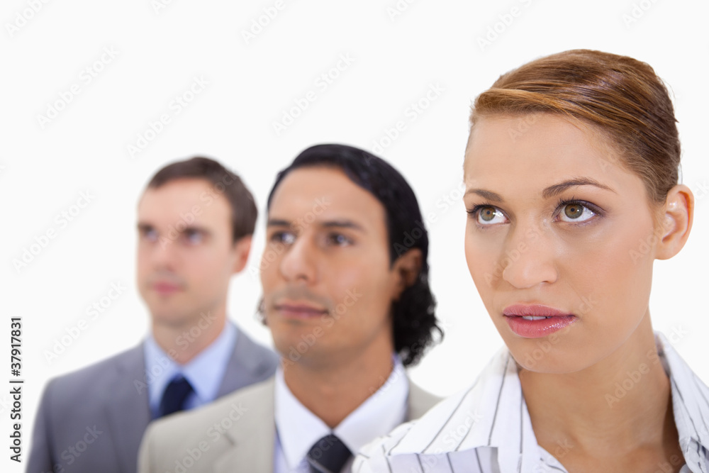 Businessteam standing in a row looking right Businessteam standing in a row looking right