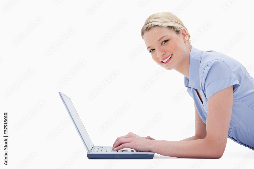 Side view of smiling woman with her laptop Side view of smiling woman with her laptop