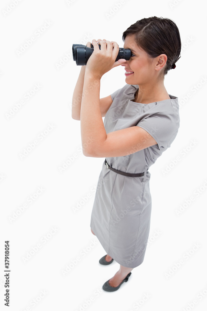 Side view of woman using spyglasses Side view of woman using spyglasses