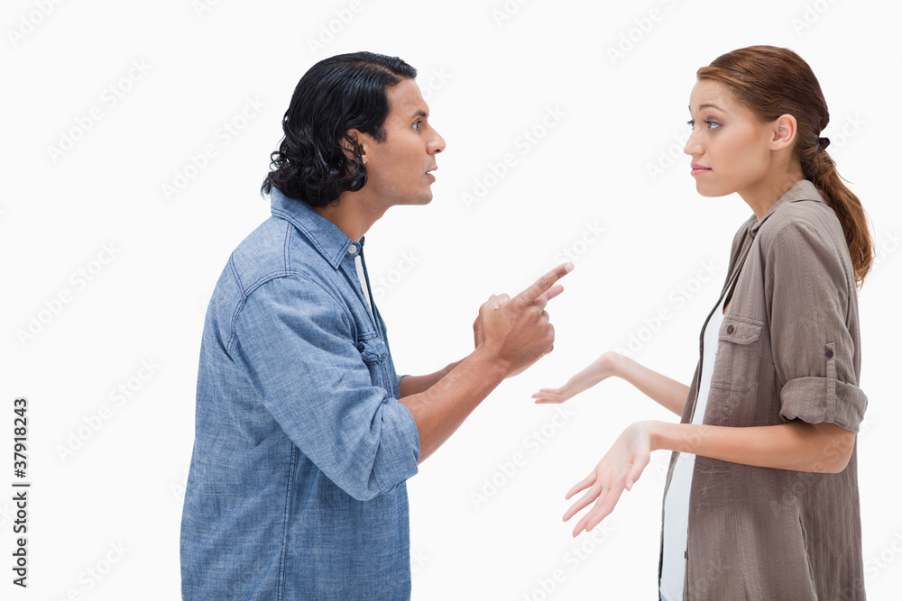 Side view of man asking his clueless girlfriend Side view of man asking his clueless girlfriend