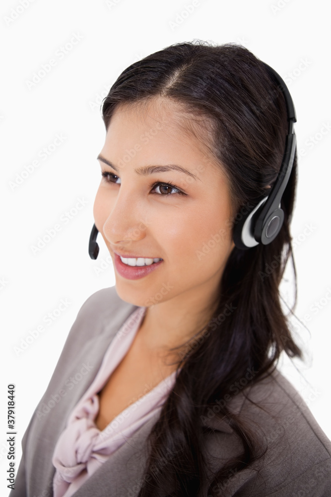 Smiling female call center agent at work Smiling female call center agent at work
