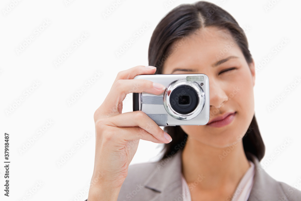 Businesswoman using camera Businesswoman using camera