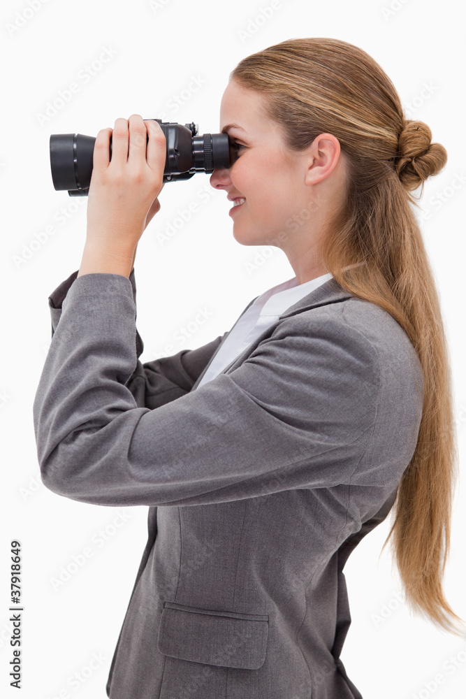 Side view of smiling bank employee with spyglasses Side view of smiling bank employee with spyglasses