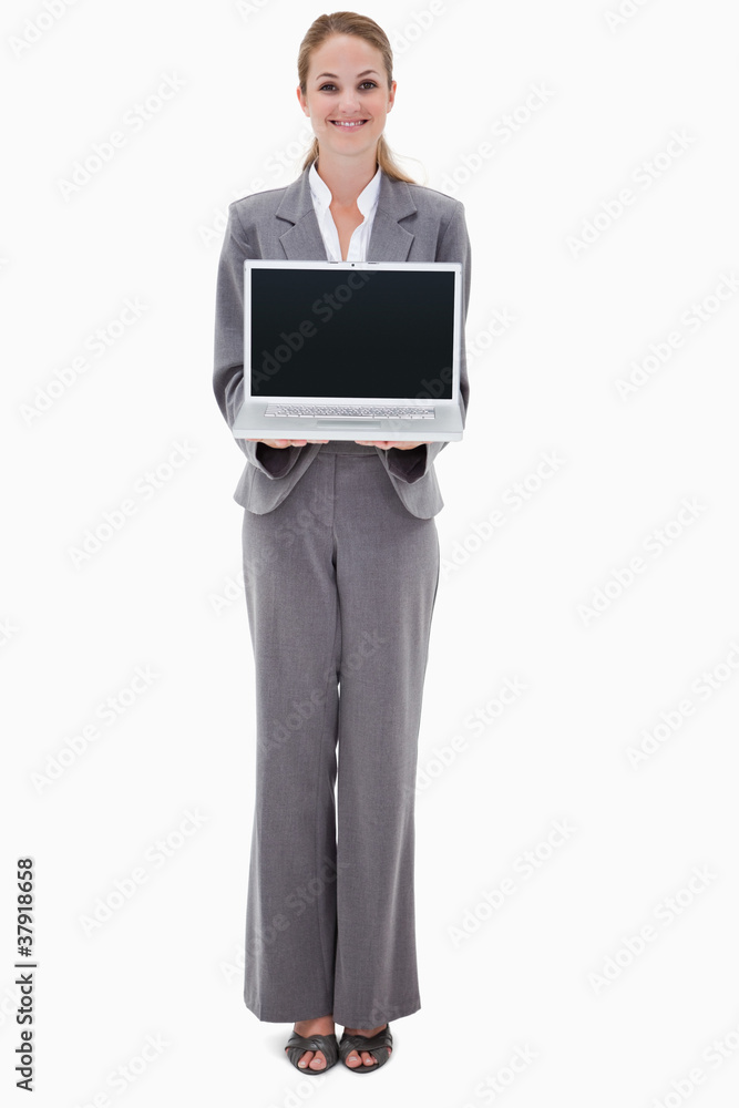 Smiling bank employee presenting her laptop Smiling bank employee presenting her laptop