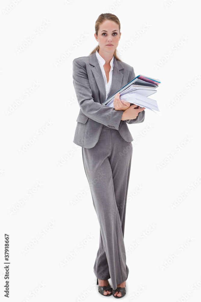 Office employee with pile of paperwork Office employee with pile of paperwork