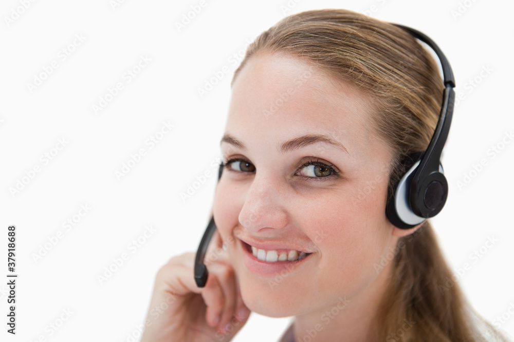 Side view of smiling call center agent with headset Side view of smiling call center agent with headset