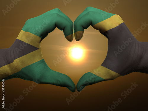 Fotografia, Obraz Heart and love gesture by hands colored in jamaica flag during b