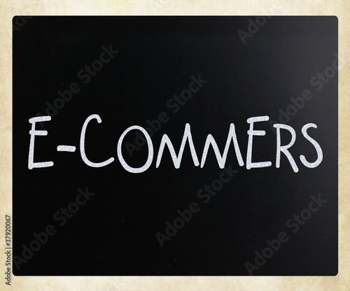 The word "E-commers" handwritten with white chalk on a blackboar