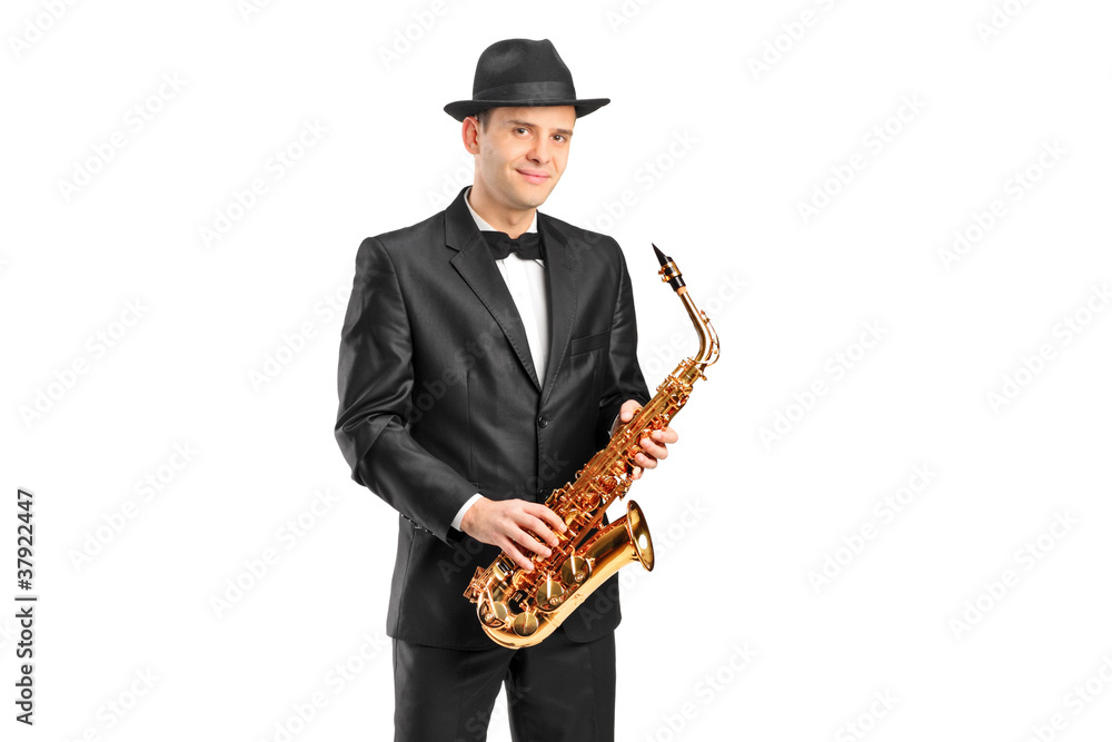 Naklejka premium A man in a suit holding a saxophone