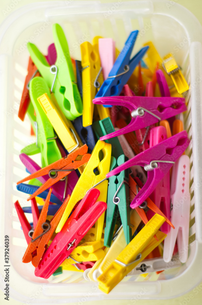 Colorful clothespins in the basket Colorful clothespins in the basket