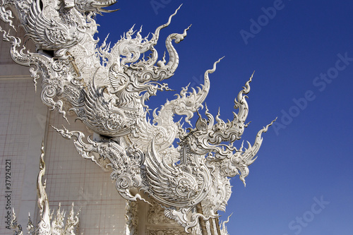 dragons at the white temple in thailand photo