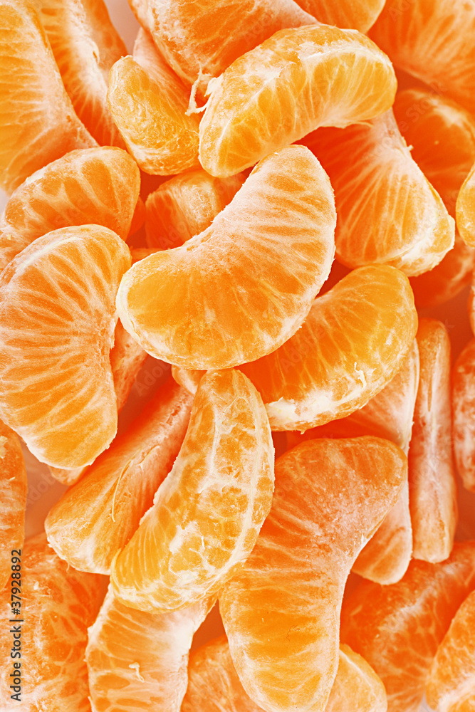 Ripe orange tangerine clove closeup Ripe orange tangerine clove closeup