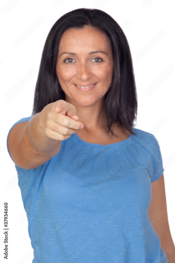 Adorable woman pointing to the front with focus on her index fin Adorable woman pointing to the front with focus on her index fin