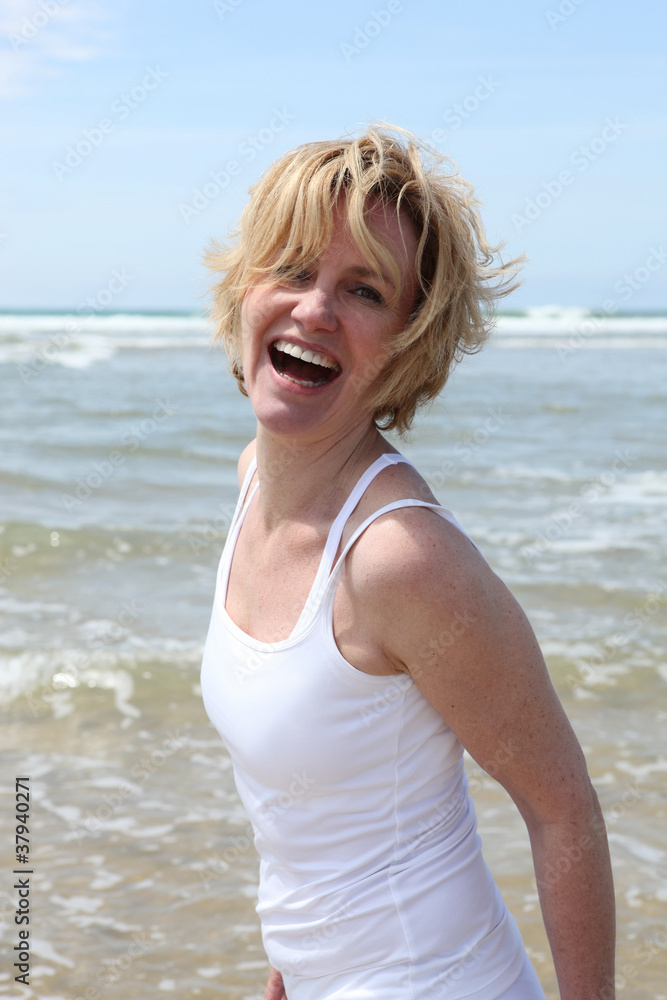 Blond woman having fun at the beach Blond woman having fun at the beach