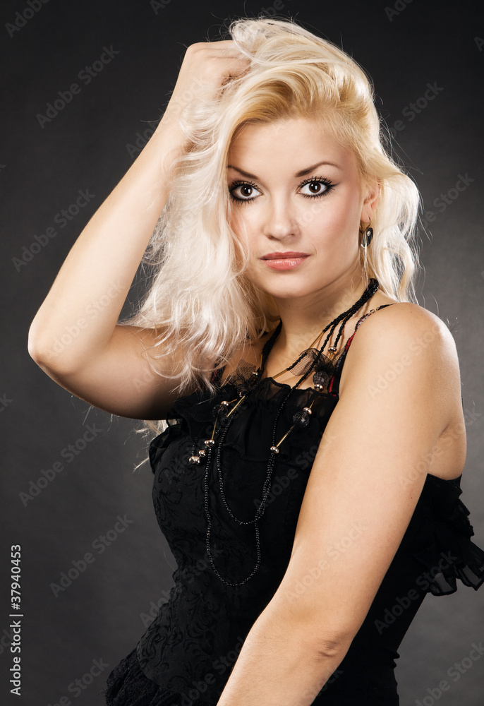 Naklejka premium Blond model on black background