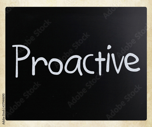 The word 'Proactive' handwritten with white chalk on a blackboar