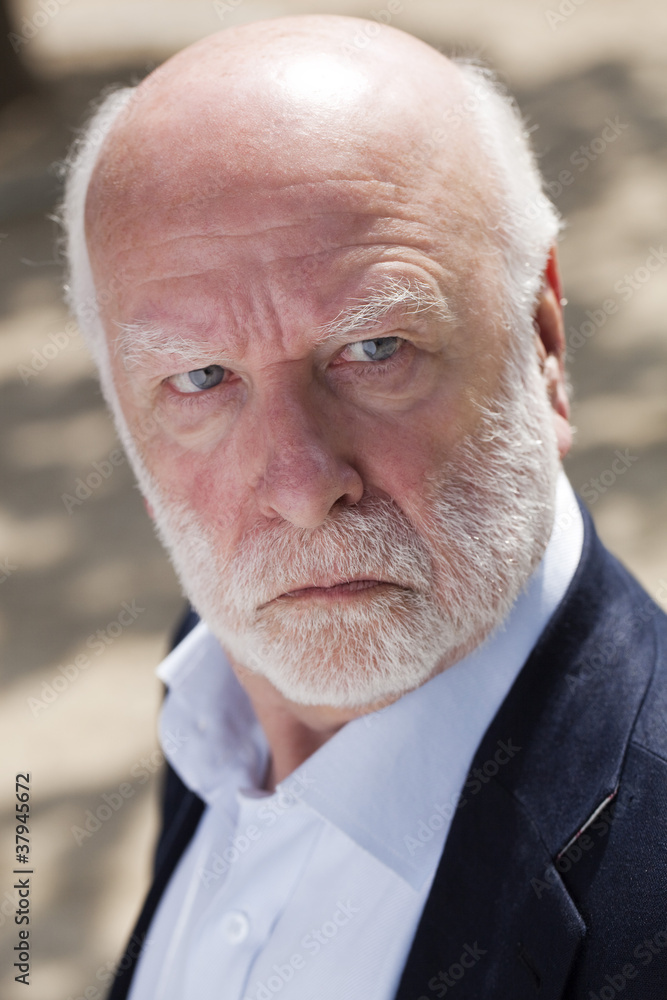 senior businessman with an aggressive look senior businessman with an aggressive look
