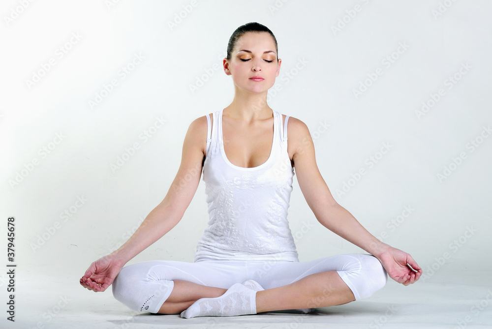 The young beautiful girl is engaged in yoga The young beautiful girl is engaged in yoga