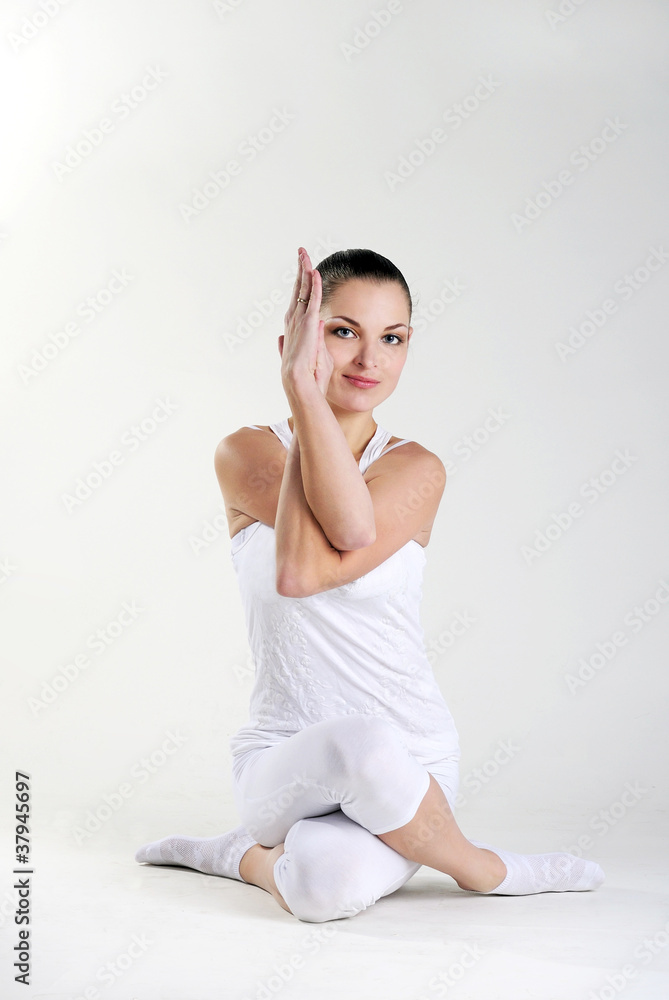 The young beautiful girl is engaged in yoga The young beautiful girl is engaged in yoga