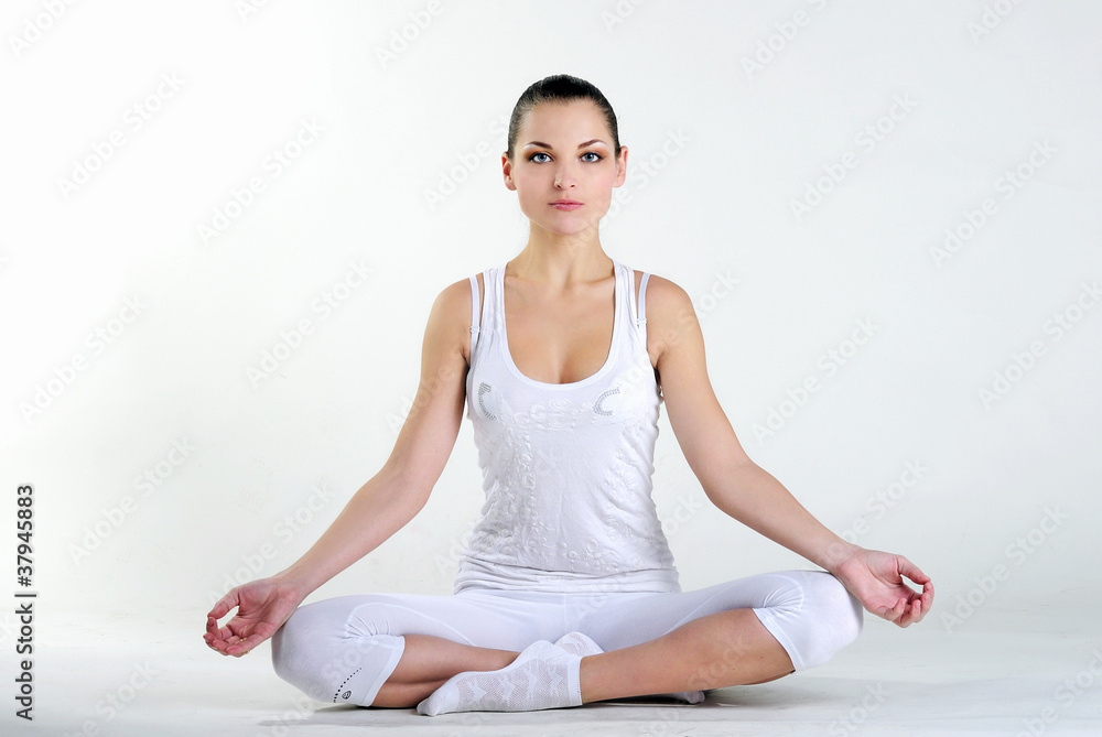The young beautiful girl is engaged in yoga The young beautiful girl is engaged in yoga