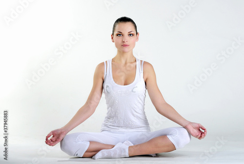 The young beautiful girl is engaged in yoga