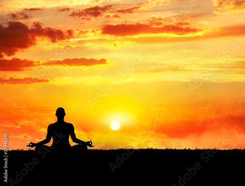Yoga meditation at sunset