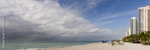 Storm clouds moving toward sunny Miami Beach