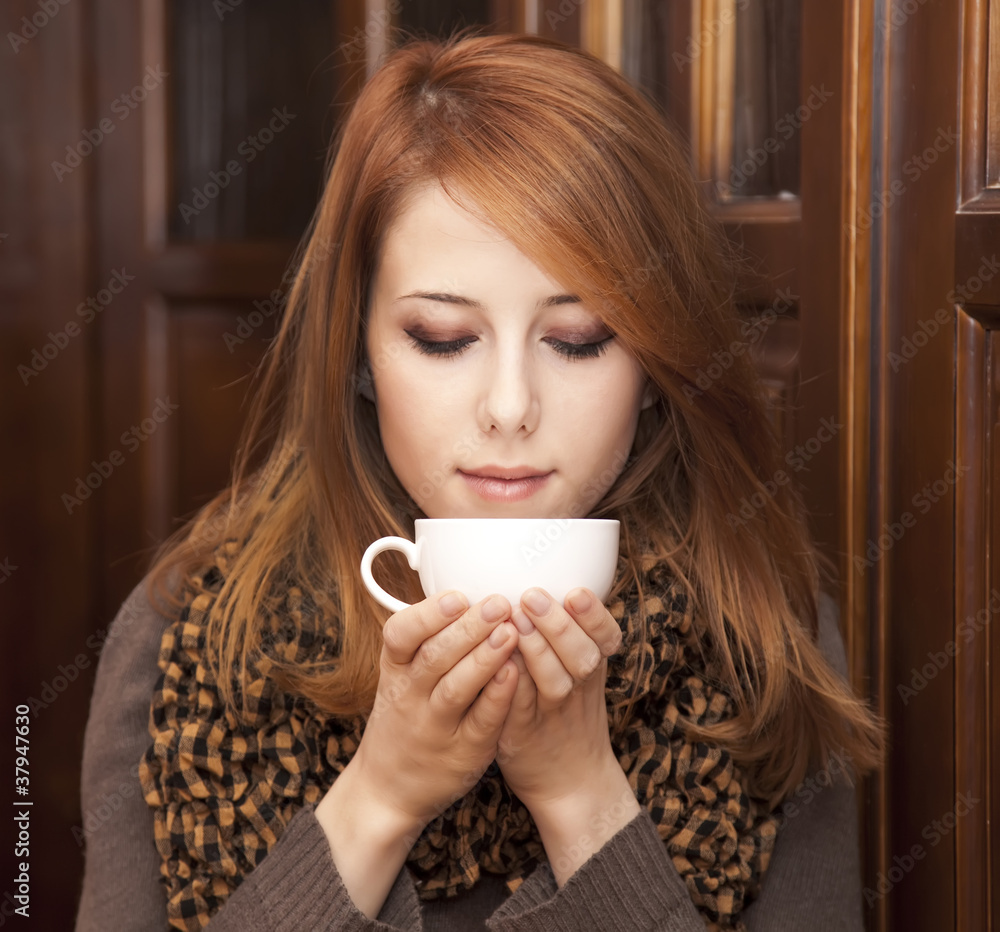 custom made wallpaper toronto digitalStyle redhead girl drinking coffee near wood doors.