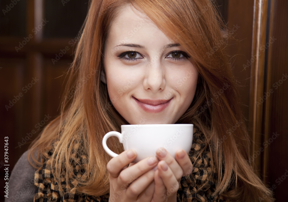 custom made wallpaper toronto digitalStyle redhead girl drinking coffee near wood doors.