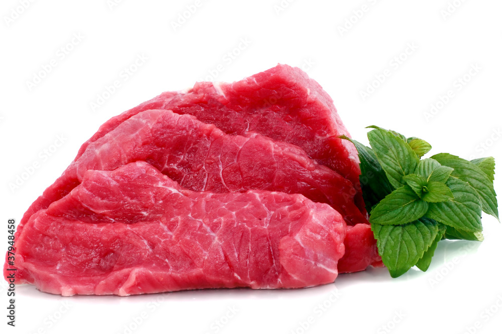 Cut of beef steak with green leaf. Isolated. Cut of beef steak with green leaf. Isolated.