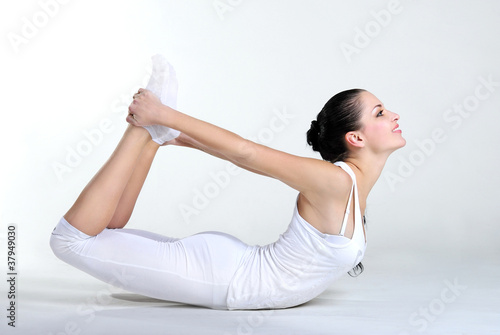 The young beautiful girl is engaged in yoga