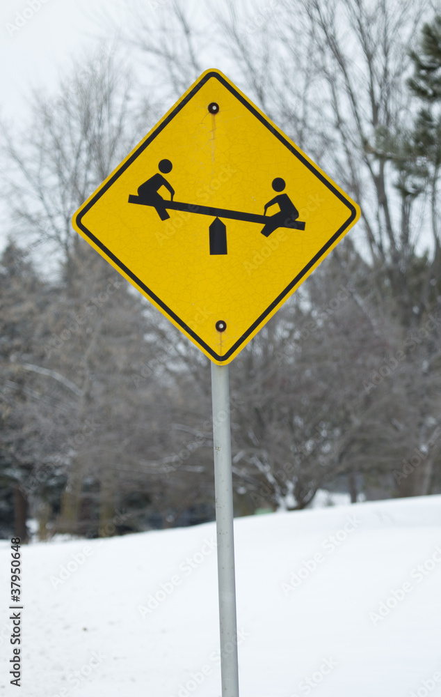 Yellow Child on Teeter Totter Sign