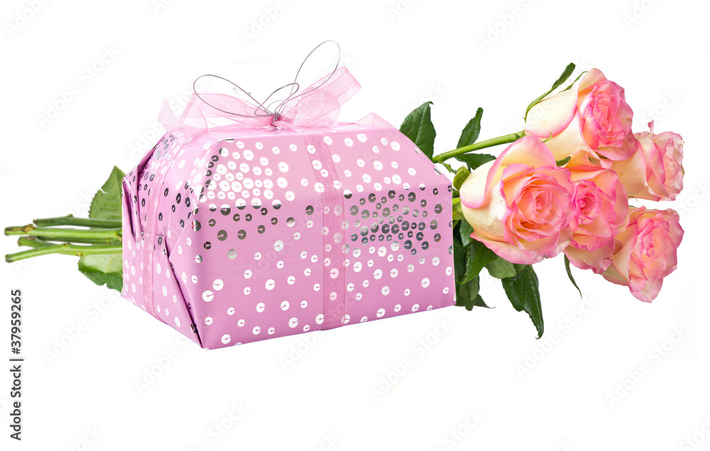 Gift and flowers isolated on white