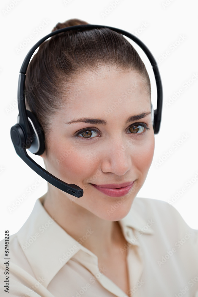 Portrait of a smiling operator posing with a headset Portrait of a smiling operator posing with a headset