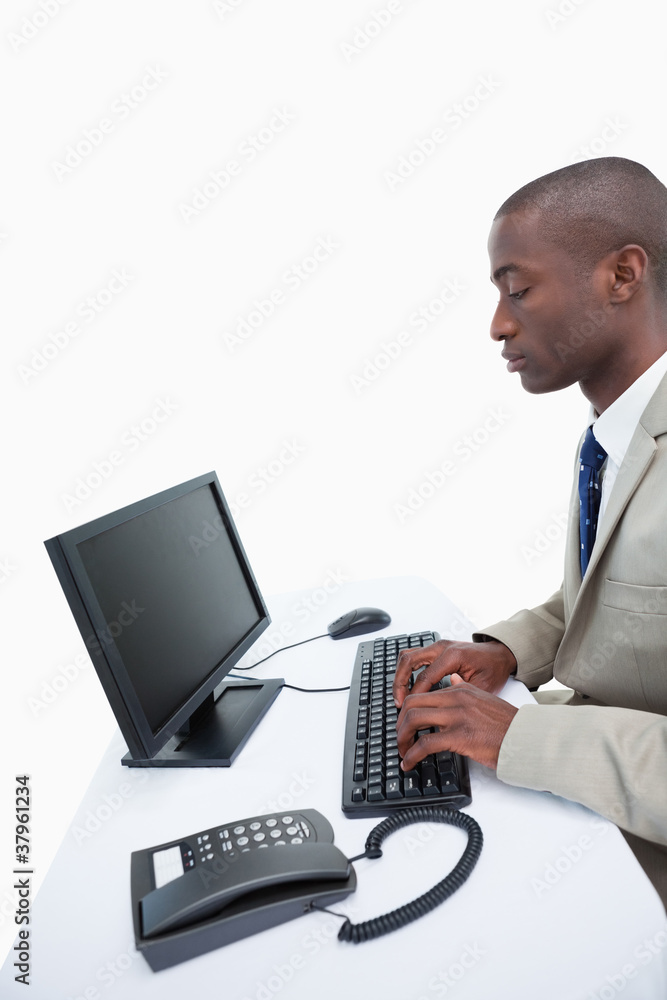 Portrait of a businessman using a computer Portrait of a businessman using a computer