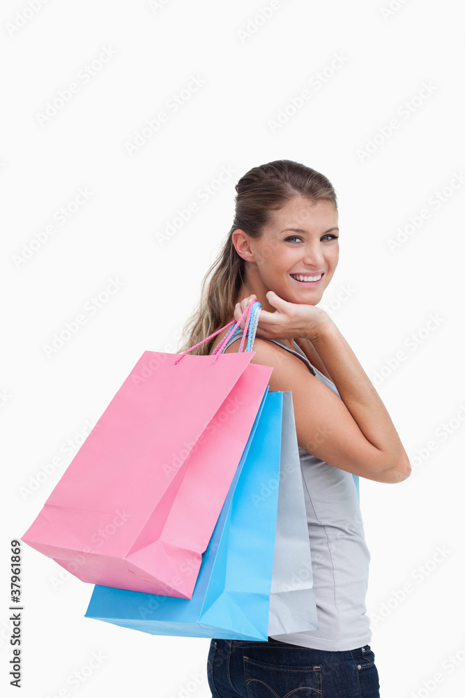 Portrait of a woman holding shopping bags