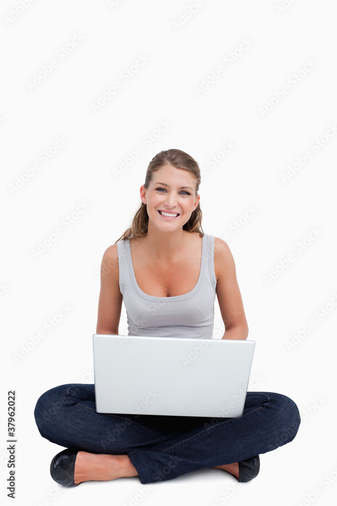Cross-legged woman using a notebook Cross-legged woman using a notebook